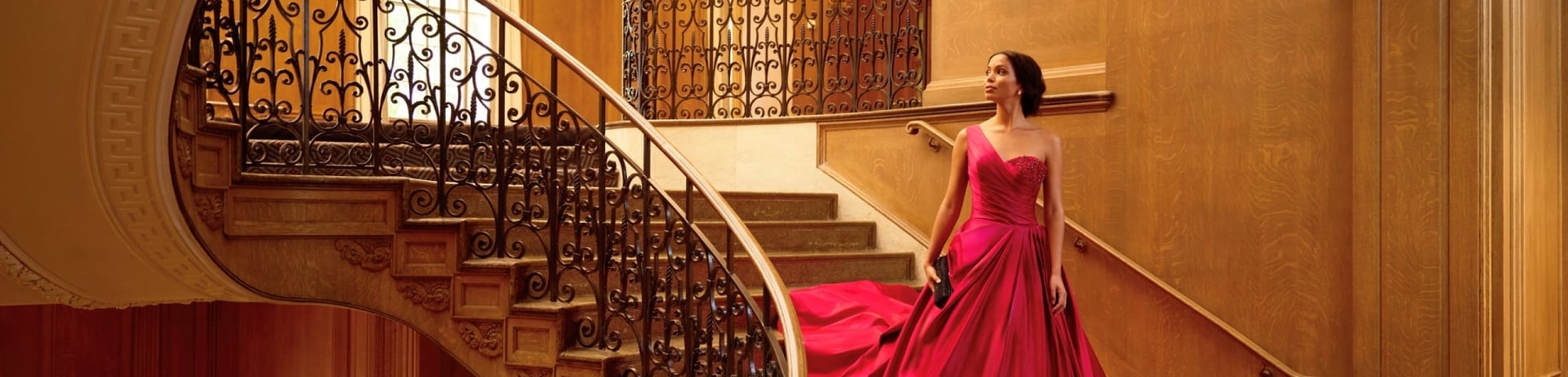 Woman in red dress on classic steps