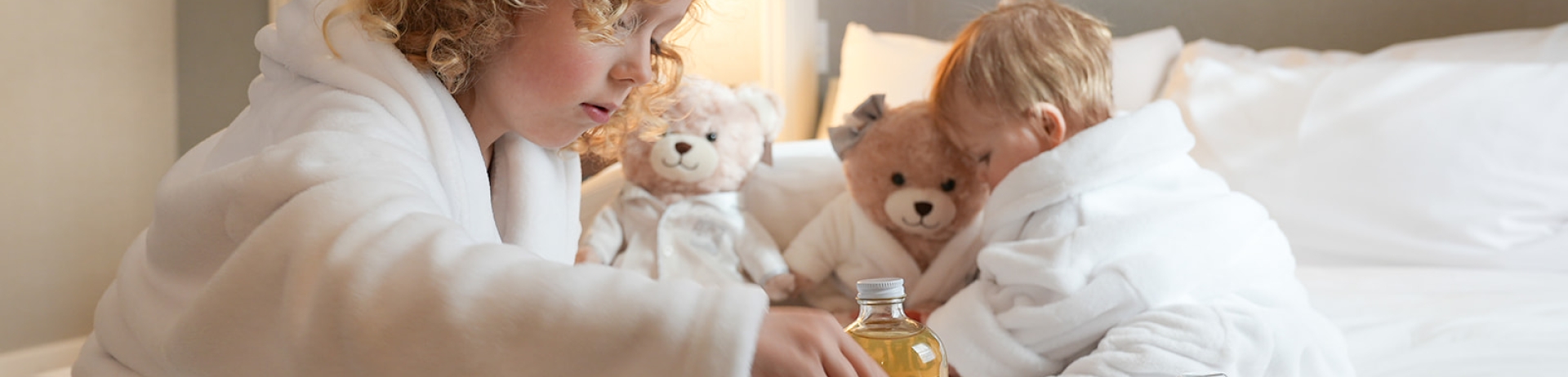 Two children on a bed